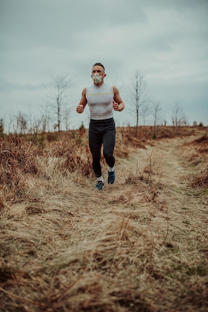 Man training with a mask due to the corona virus