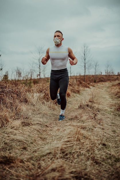 Man training with a mask due to the corona virus