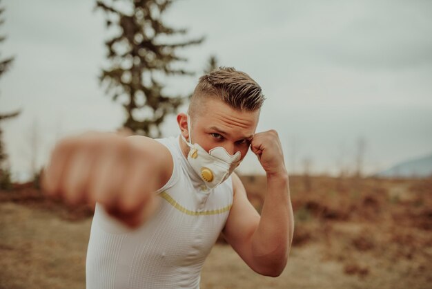 Man training with a mask due to the corona virus