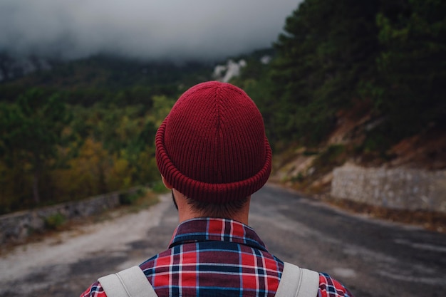 Man traveling with a backpack hiking in the mountains travel