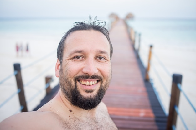 Man on tropical jetty