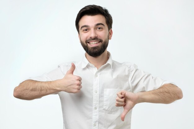 Man trying to make a desicion making good or bad sign