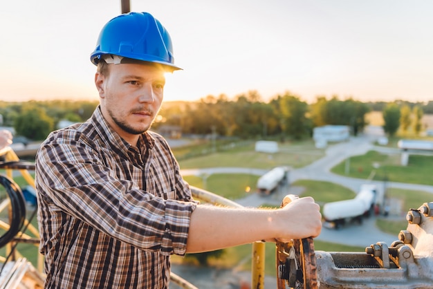 Man turning big valve