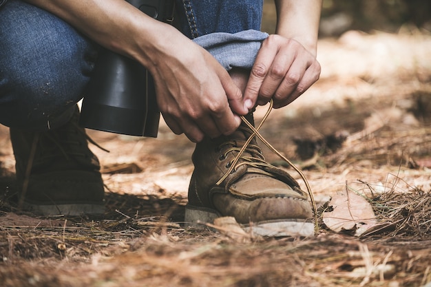 Man tying shoelace for trekking