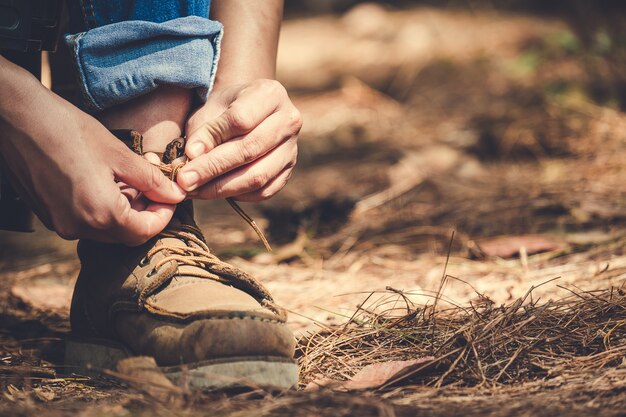 Man tying shoelace for trekking