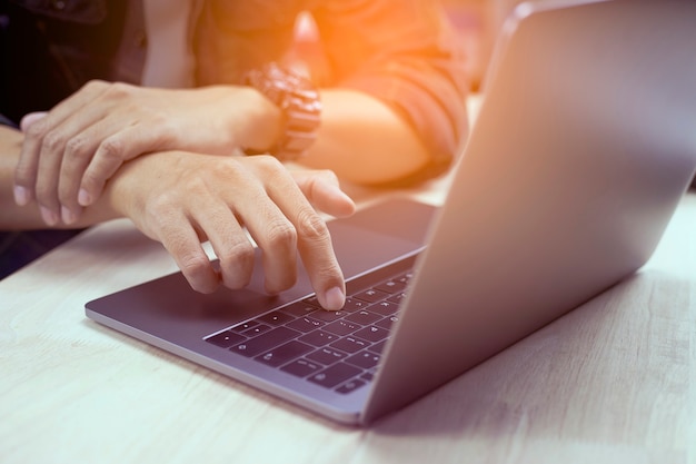 Man typing keyboard on laptop or computer