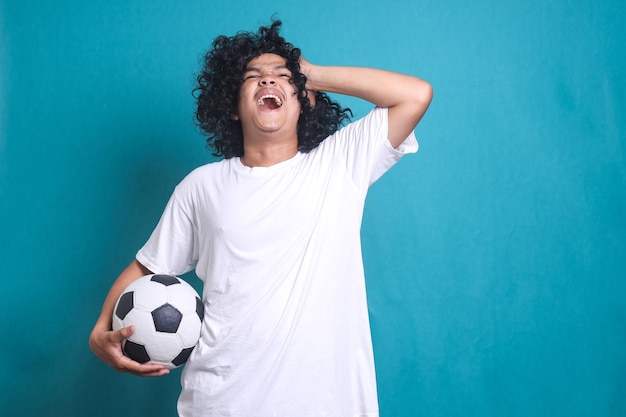 Man upset about defeat of football team, watching tv broadcast, unhappy fan