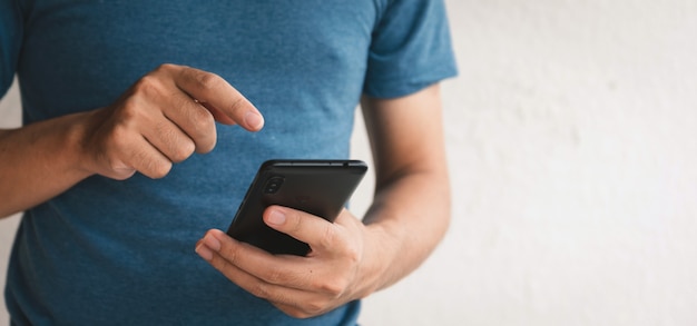 man using cellphone for searching data and social media on internet