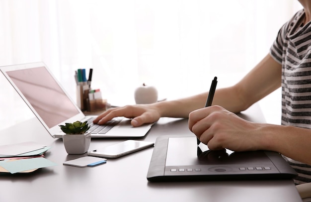 Man using graphic tablet at office