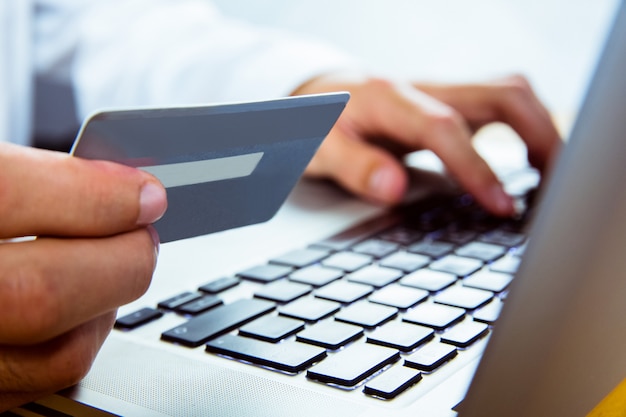 Man using laptop for online shopping