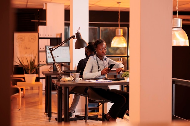 Man using laptop while sitting on table