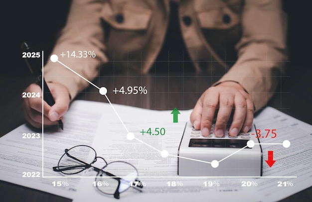 Photo man using a laptop with tax refund and refund tax of duty taxation business graphs and chart being demonstrated on the screen media tablet pc and selecting tax refund saving tax for business