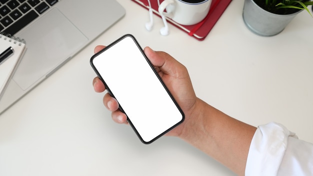 Man using mobile phone in office