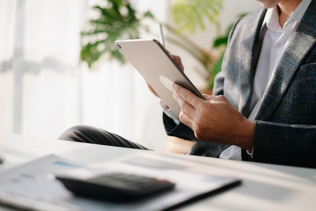 Man using on smartphone and tablet at home as conceptxA