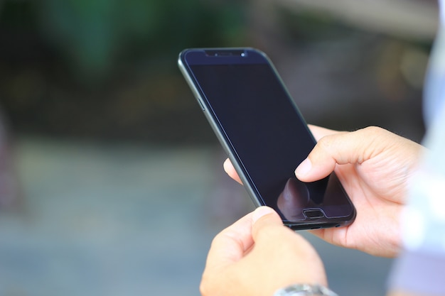 Man using a smartphone with blank screen, Communication technology 