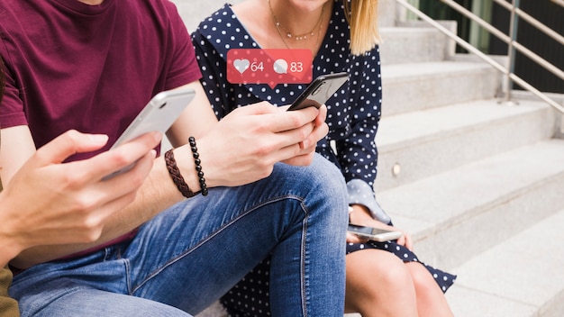 A man using social media network notification icons over the mobile