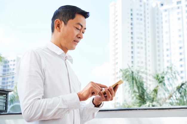 Man using telephone outdoors