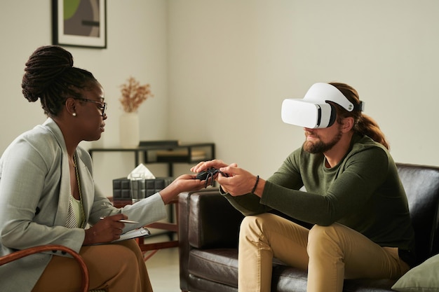 Man using VR glasses during psychotherapy session