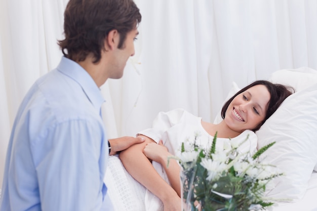 Man visiting his girlfriend in the hospital