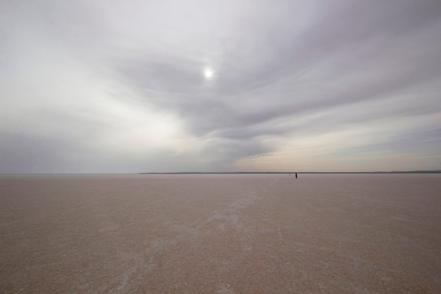 Man walking by the salt lake