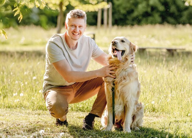 Man walking golden retriever