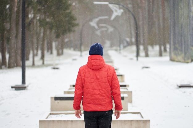 Man walking in a snowy park