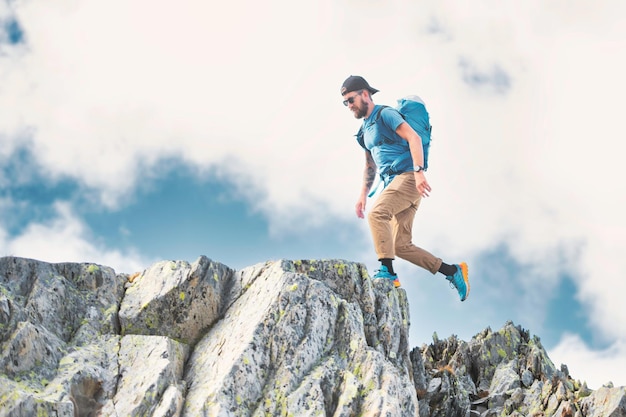 Man walks among rocks in the mountains