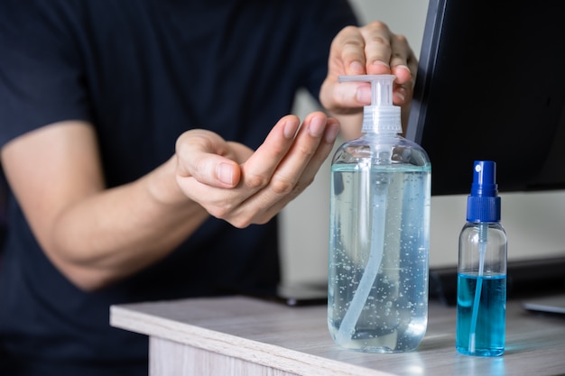 Man washing hand with sanitizer gel