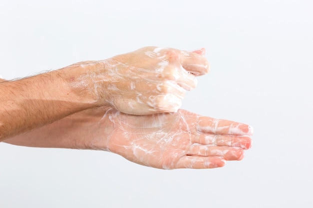 man washing hands isolated over white background