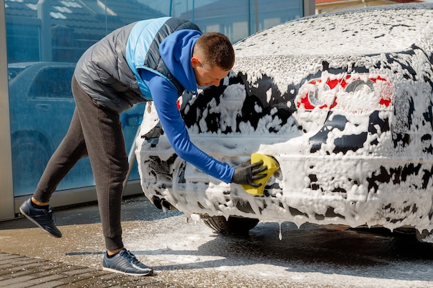 The man washing his car on self-service car wash. Express Car Wash