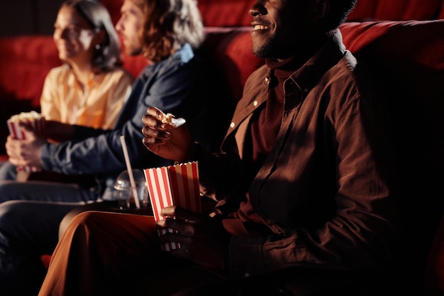 Man watching movie with his friends