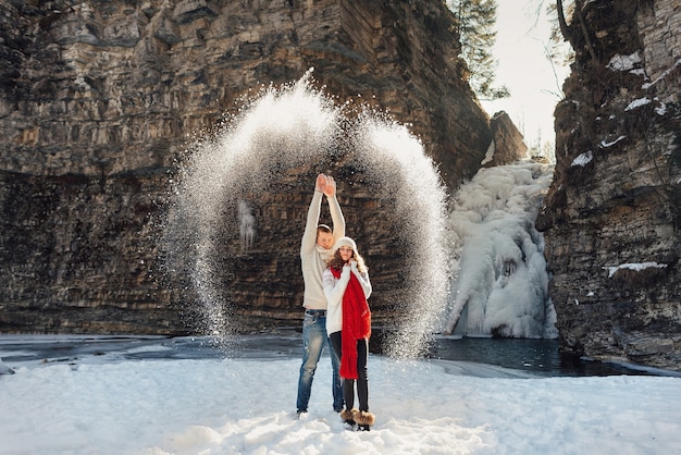 Man waved his hands and threw snow