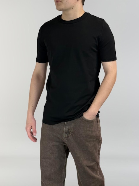 A man wearing a black t - shirt with a black shirt that says'the word'on it '