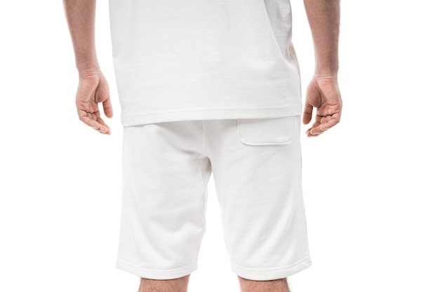 Man wearing blank white shorts isolated on white background