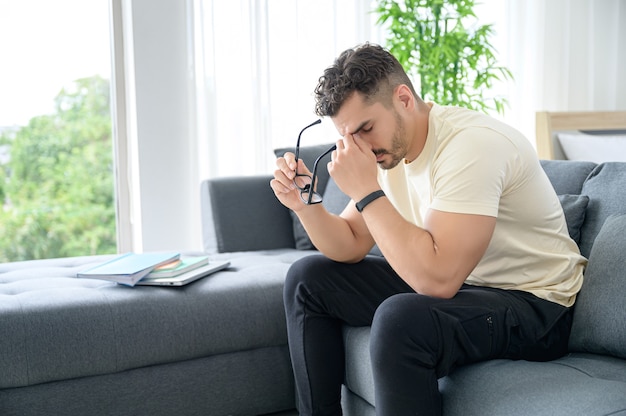 A Man wearing casual cloth working from home, online meeting, video call, conference and studying online with stressful