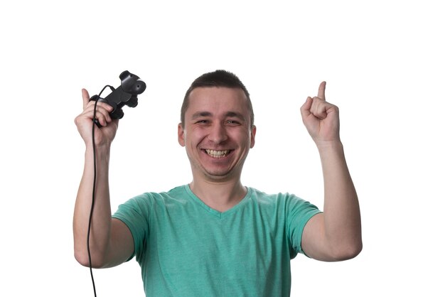 Man Wearing A Green Tshirt And He Is Playing Video Games  Over White Background Isolated