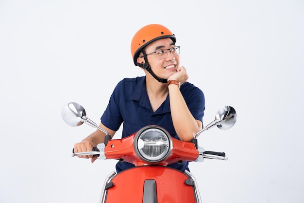 a man wearing a helmet and driving a motorcycle