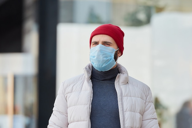 A man wearing a medical face mask to avoid the spread coronavirus (COVID-19).