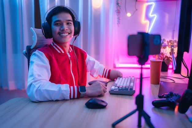 a man wearing a red jacket with headphones and a microphone