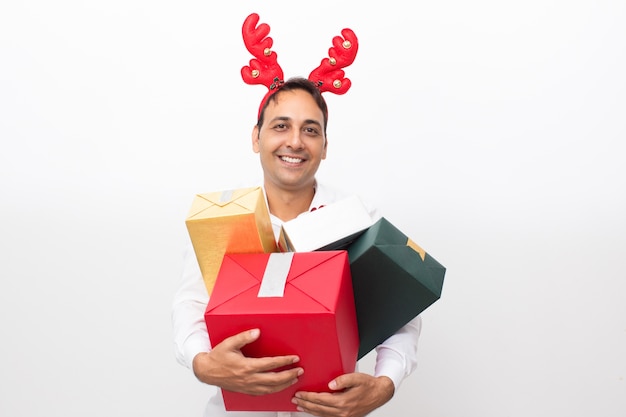 Man Wearing Reindeer Horns and Holding Gift Boxes