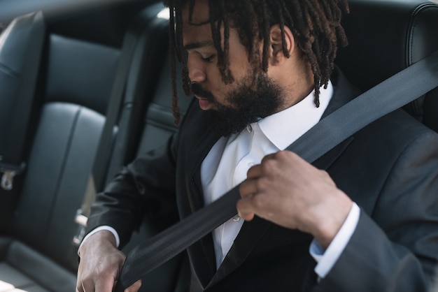 Man wearing seat belt medium shot