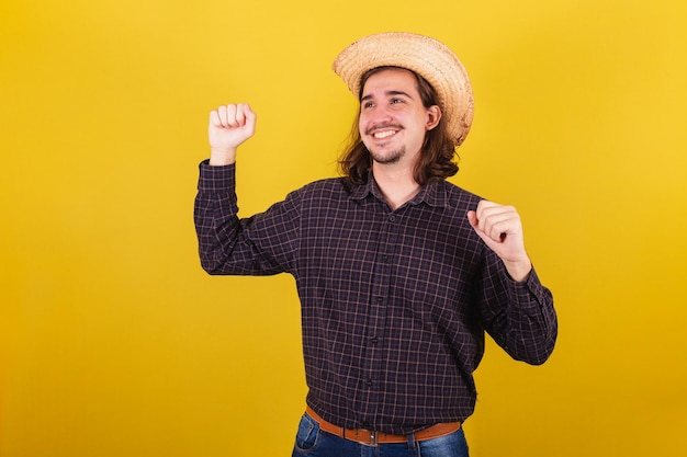 Man wearing typical clothes for party Junina Dancing partying and celebrating