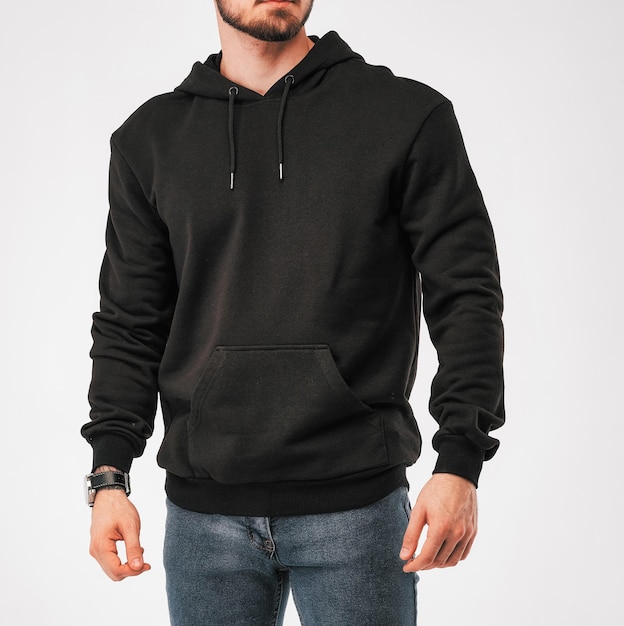 Man wears black hoodie isolated clothing mockup photo