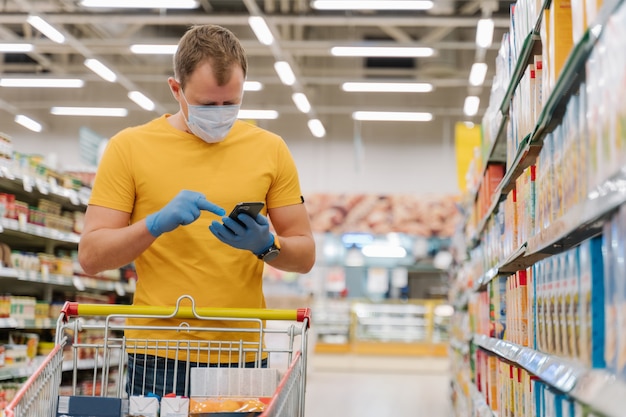 Man wears medical mask and gloves to reduce risk of acquiring human influenza