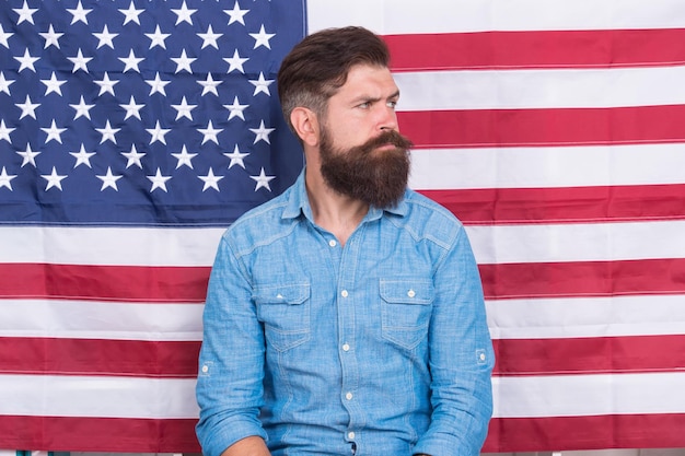 Man well groomed hipster stylish appearance american flag background serious face concept