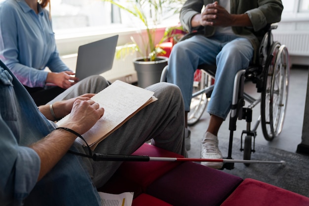 Man in a wheelchair having an office job