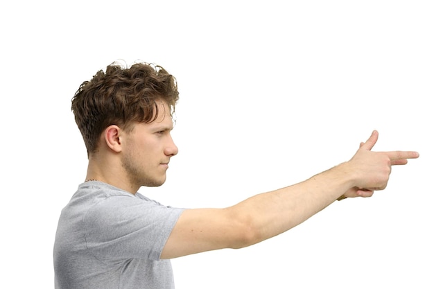 Photo a man on a white background in closeup points to the side