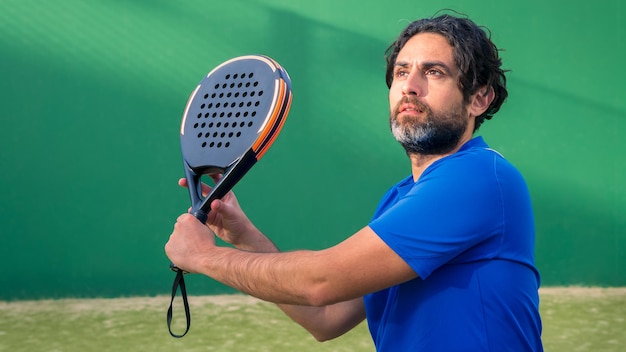 Man who playing padel tennis with space for text Caucasian player sportsman