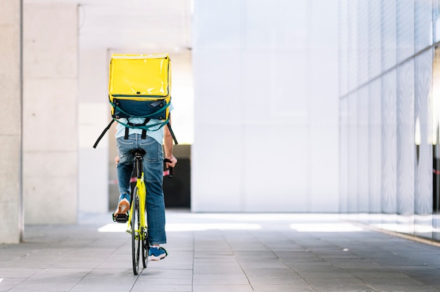 Man who works delivering food by courier to home.