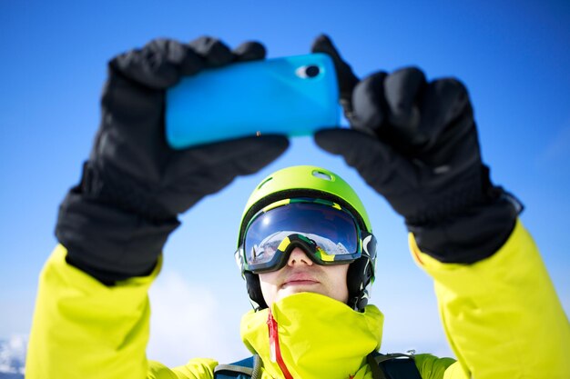 Man in winter clothes taking a selfie